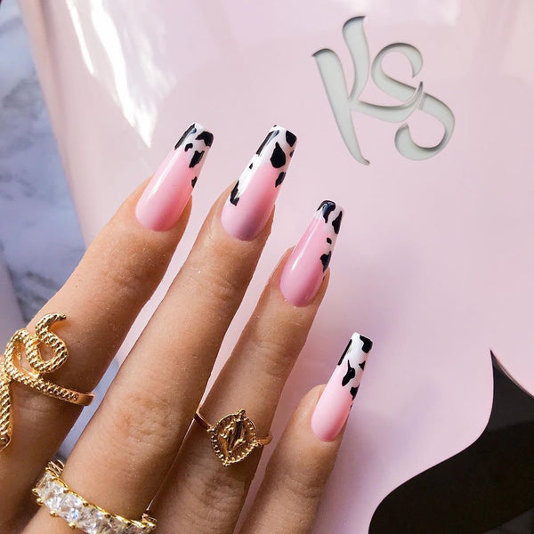 black and white cow print nails