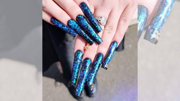 dark blue acrylic nails with glitter