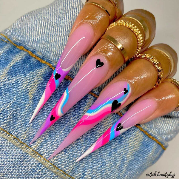 heart nail design with multi-colored swirls