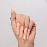 Kiara Sky Autumn Blonde cover acrylic powder applied to a light-skinned hand