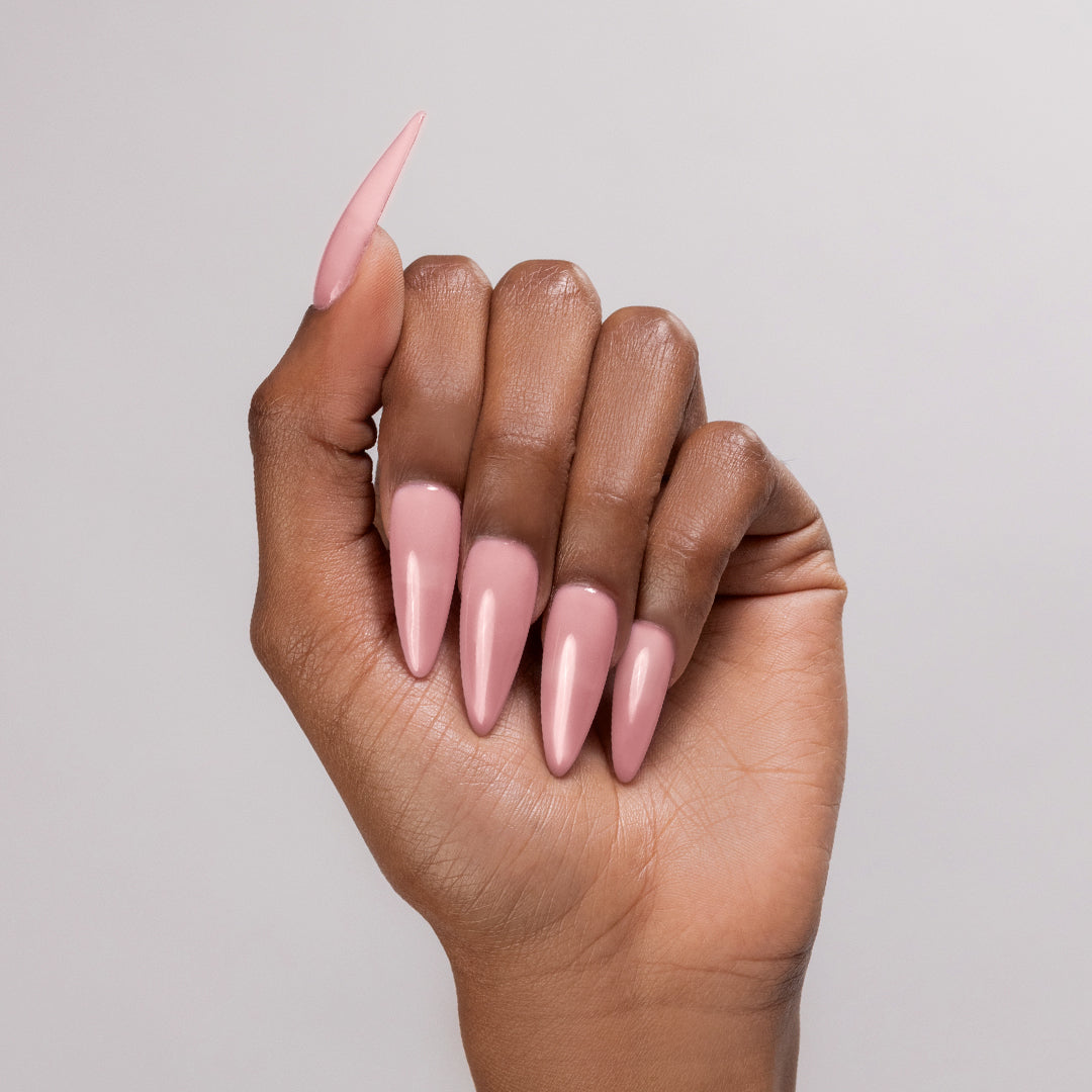 So Romantic acrylic powder applied to dark-skinned hand