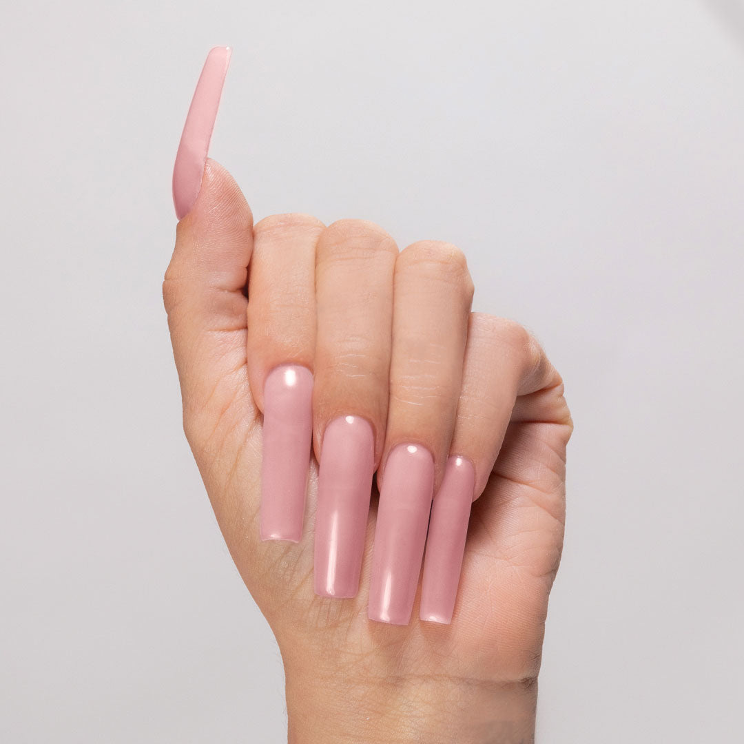 So Romantic acrylic powder applied to light-skinned hand