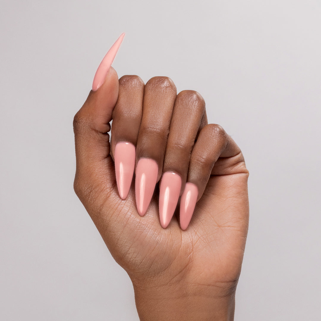 Natural Babe acyrlic powder applied to dark-skinned hand