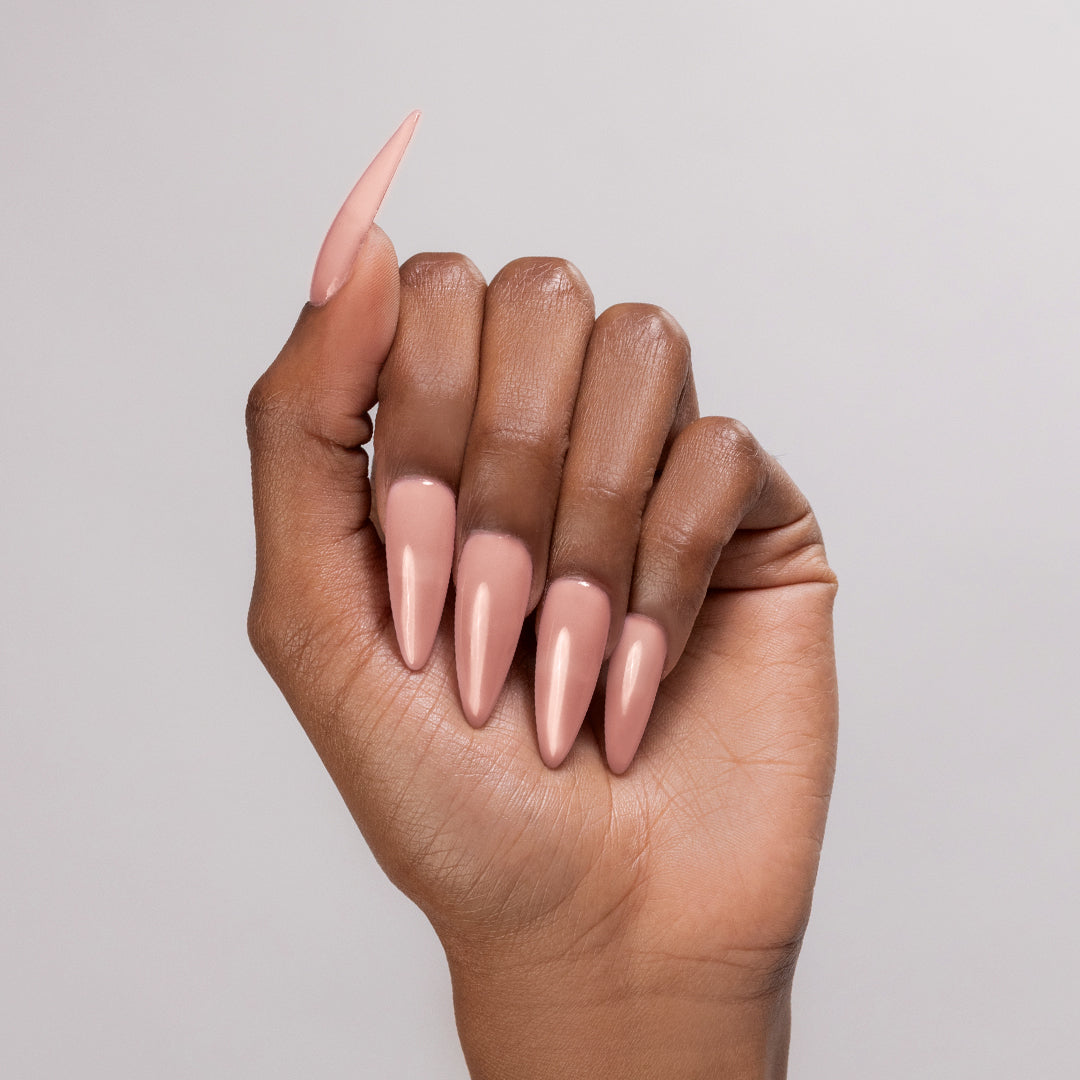 Sheer Me Out acrylic powder applied to dark-skinned hand