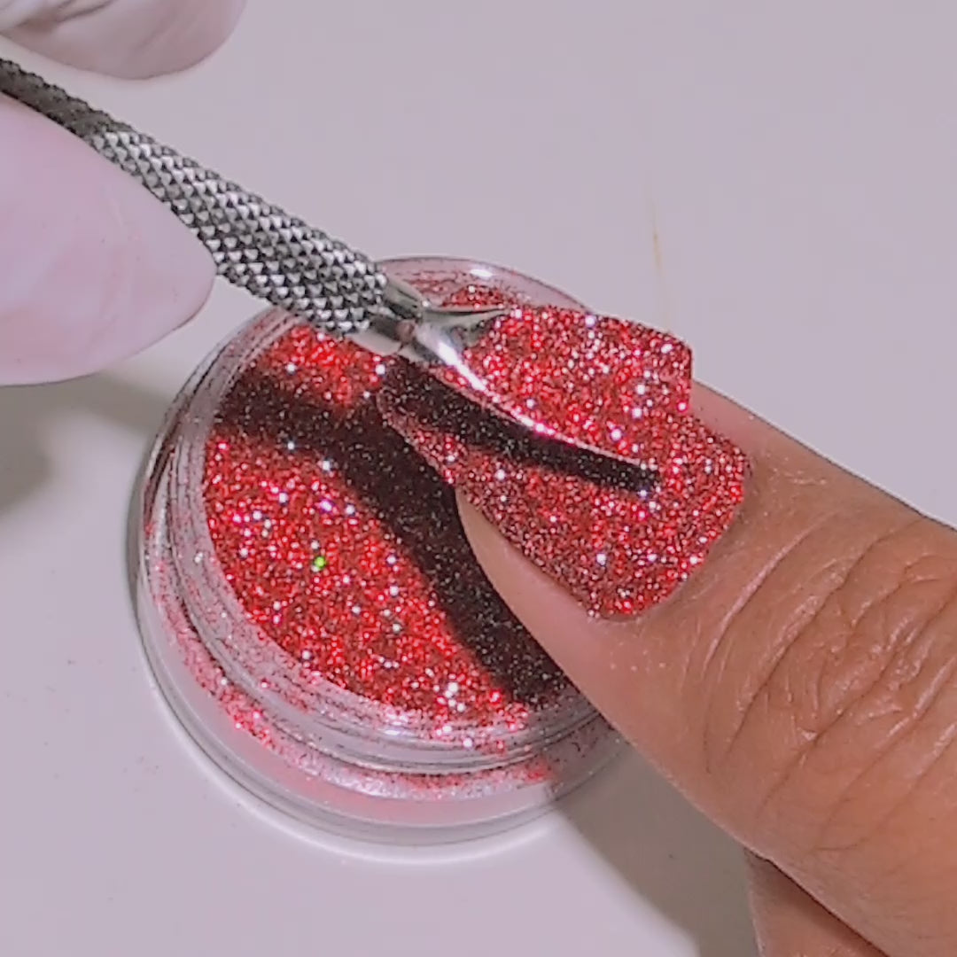 Ruby Stardust glitter applied to nails