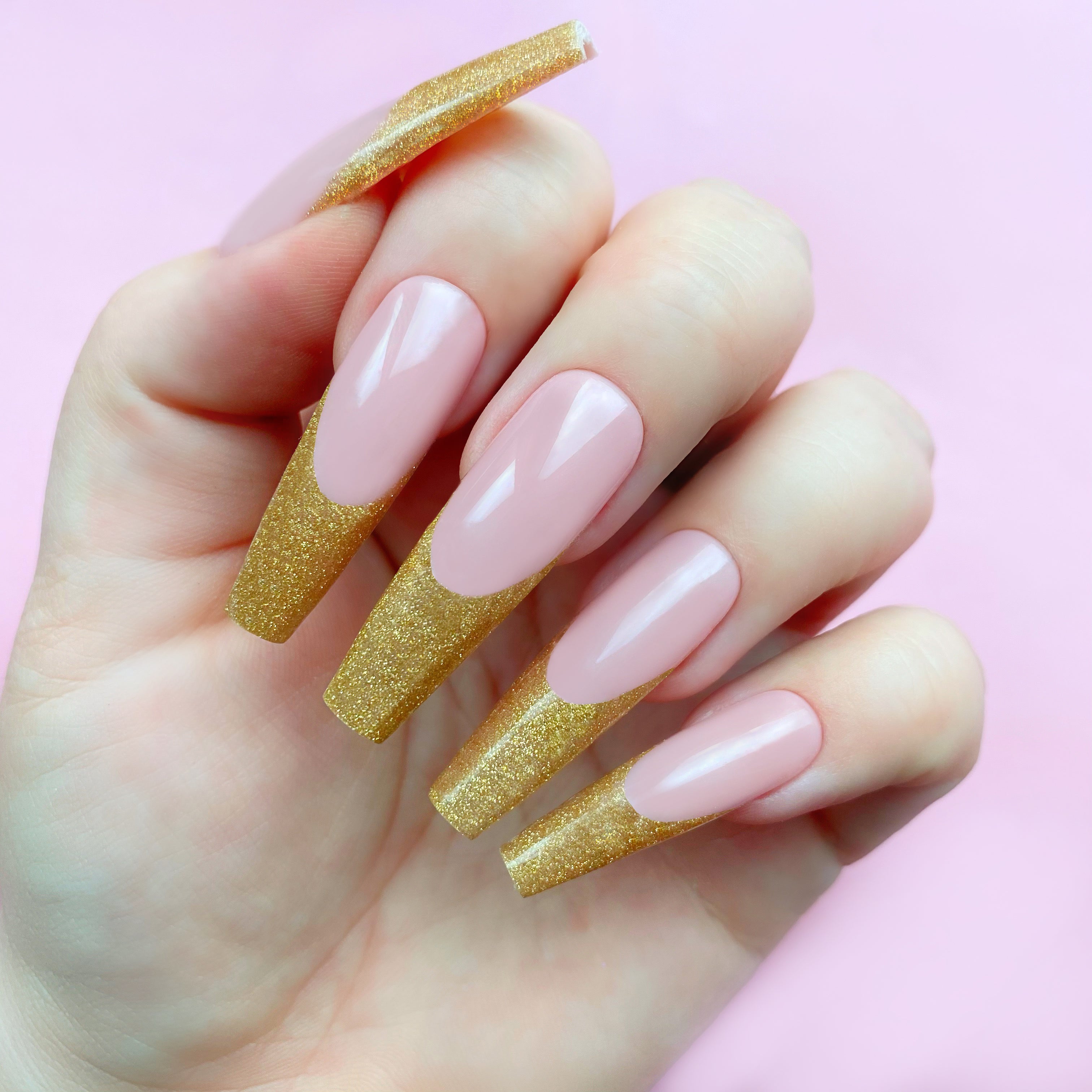 Gold Exhibit gel art bottle applied to nail extension tips