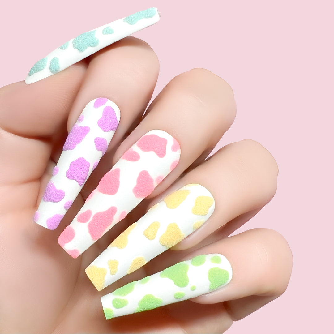 Good Muse gel art applied to nail extensions with cow print design