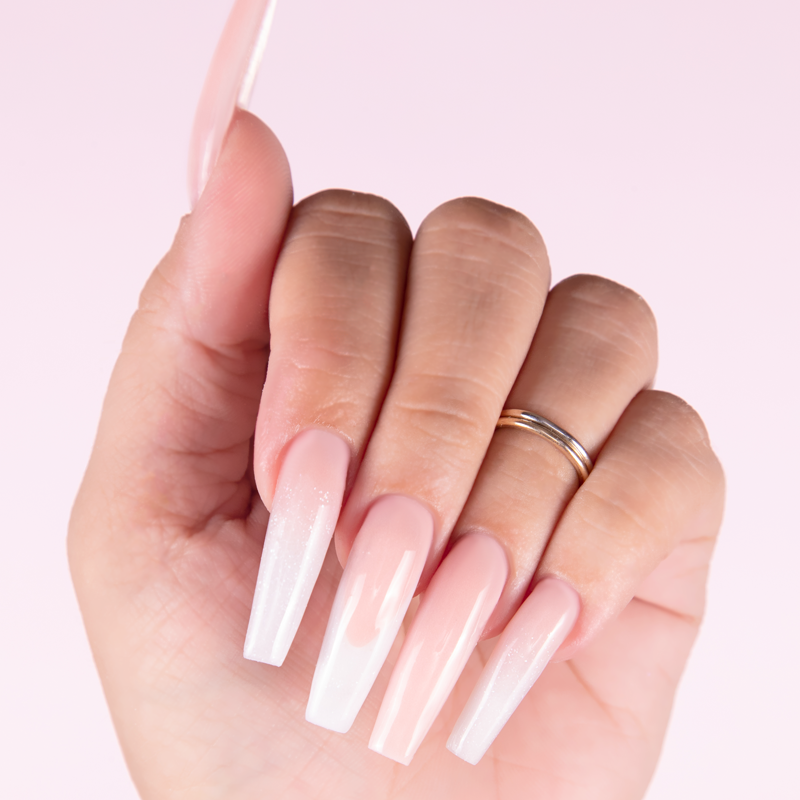 Glistening Snow cover acrylic powder applied to nail extensions