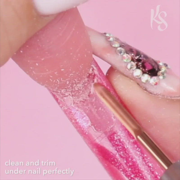 Kiara Sky Under Nail Cleaner Drill Bit being used on a nail