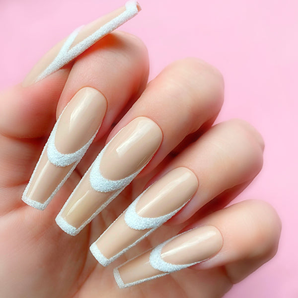 White Canvas gel art applied to nail extensions with custom design