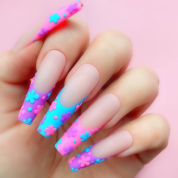 Surreally Blue gel art applied to nail extensions with flower design