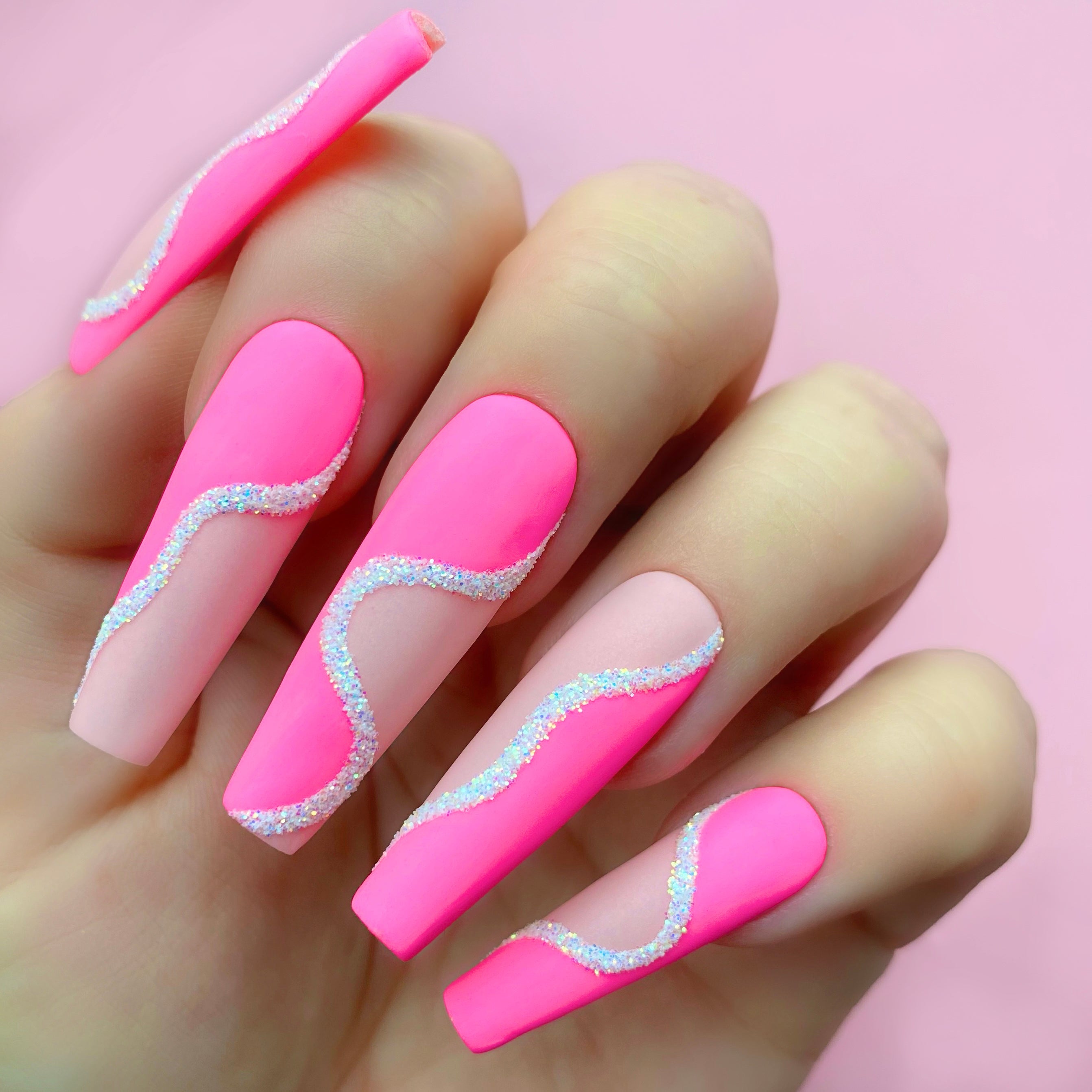Pinkaso gel art applied to nail extensions with wavy design