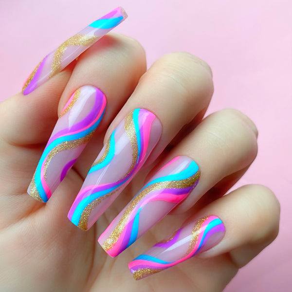 Pinkaso gel art applied to nail extensions with swirly design