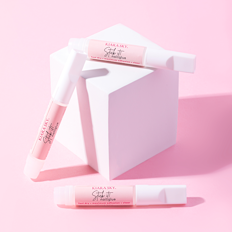 Kiara Sky Stick It Nail Glue sticks with shadows and a white cube